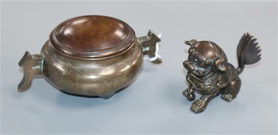 An 18th/19th century bronze silver inlaid Shi Sou censer with wooden lid and an 18th century bronze dog of Fo